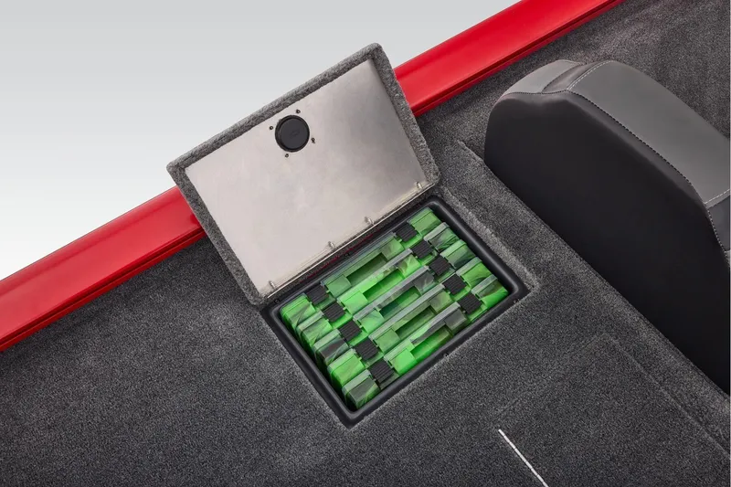 Slide: The Image of 2026 Tracker Pro Team 190 boat storage compartment with organized green tackle boxes. - 40