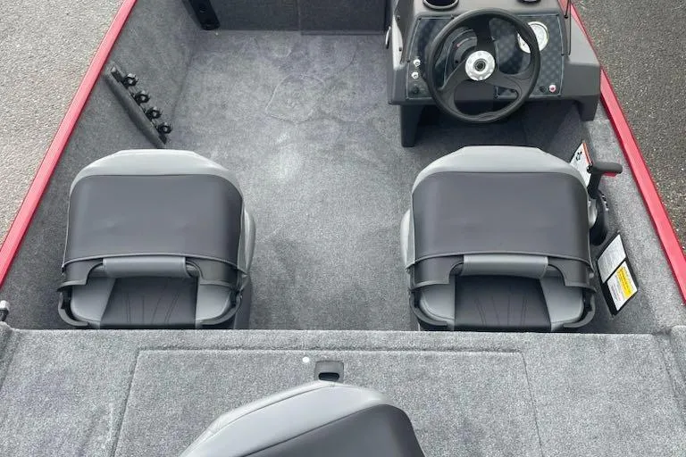 Slide: The Image of 2026 Tracker Bass Tracker Classic XL interior with dual seats and steering console. - 2