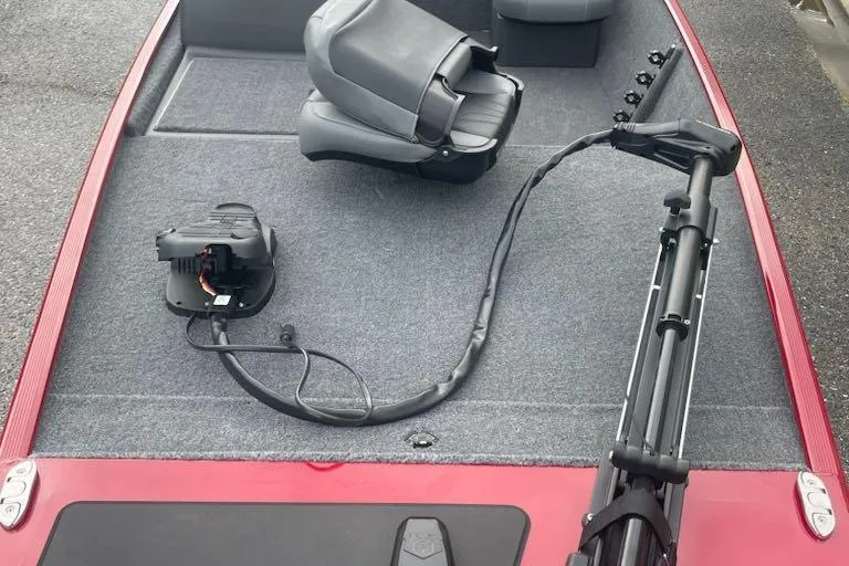 Slide: The Image of 2026 Tracker Bass Tracker Classic XL boat interior with seating and trolling motor. - 3