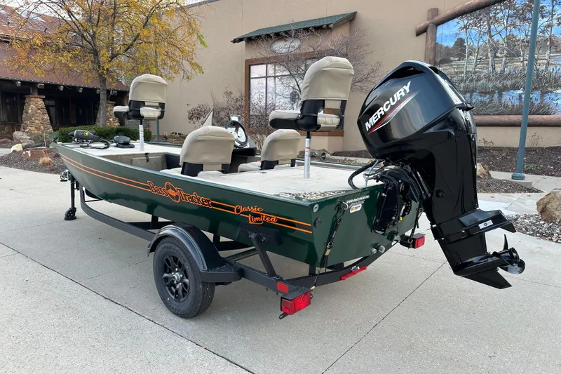 Slide: The Image of 2026 Tracker Bass Tracker Classic Limited boat with Mercury engine on trailer. - 2