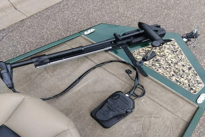 Slide: The Image of 2026 Tracker Bass Tracker Classic Limited boat deck with trolling motor and camouflage detail. - 2