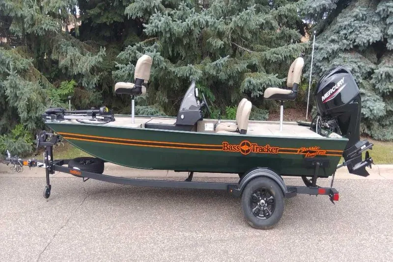 Slide: The Image of 2026 Tracker Bass Tracker Classic Limited fishing boat on trailer, parked outdoors. - 8