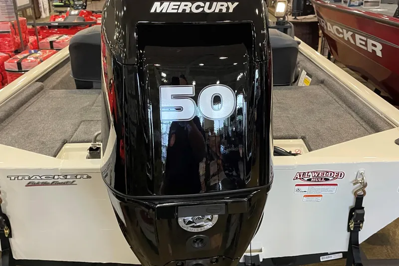 Slide: The Image of 2026 Tracker Pro 170 boat with Mercury 50 outboard motor in showroom. - 3