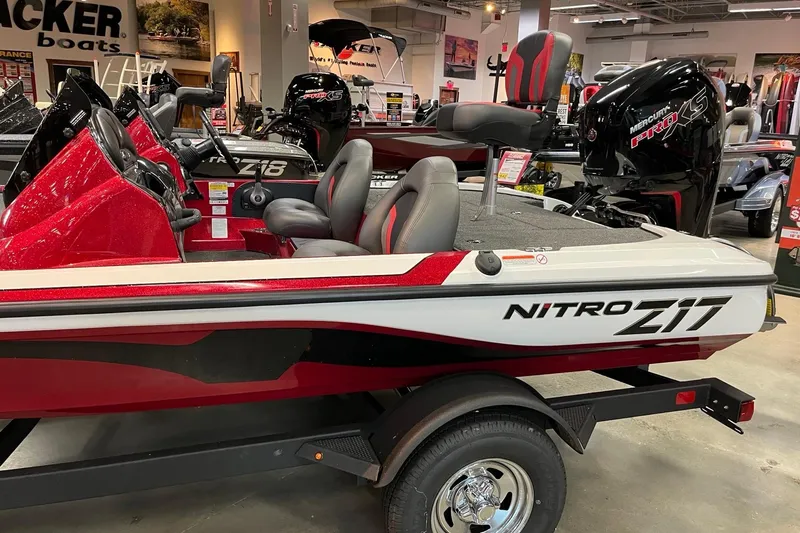 Slide: The Image of 2026 Nitro Z17 boat in showroom, featuring sleek red and white design. - 3