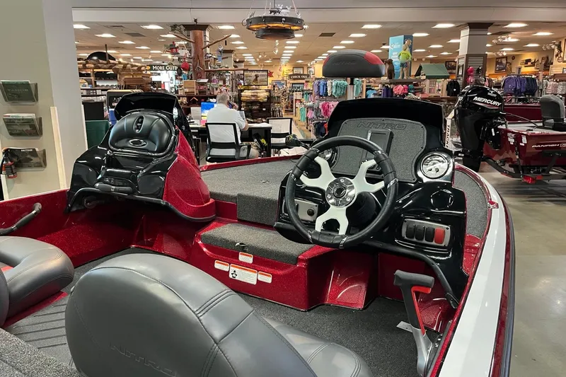 Slide: The Image of Interior of a 2026 Nitro Z17 boat displayed in a showroom. - 4