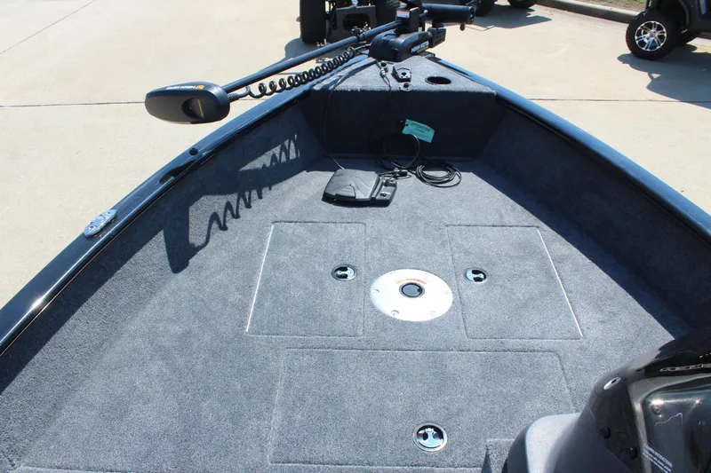 Slide: The Image of 2026 Tracker Super Guide V-16 SC boat deck with trolling motor and storage compartments. - 11