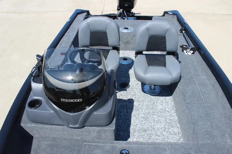 Slide: The Image of 2026 Tracker Super Guide V-16 SC boat interior with dual seats and steering console. - 15