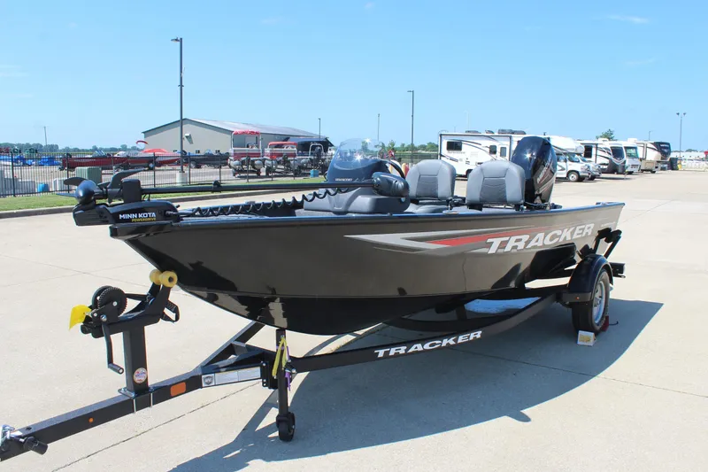 Slide: The Image of 2026 Tracker Super Guide V-16 SC boat on trailer in parking lot. - 3