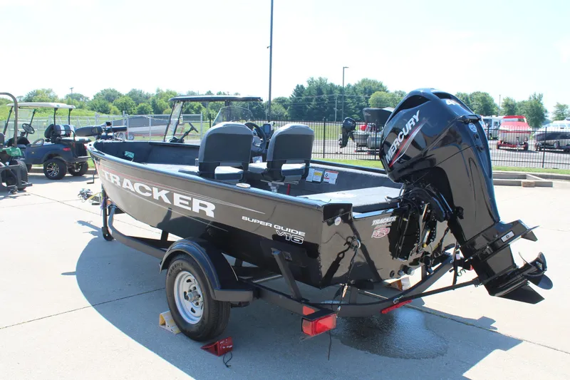Slide: The Image of 2026 Tracker Super Guide V-16 SC boat with Mercury engine on trailer. - 5