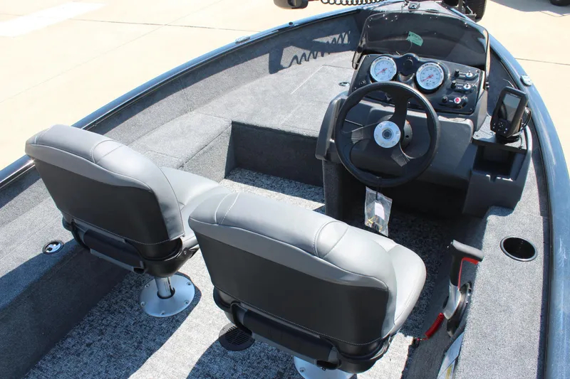 Slide: The Image of 2026 Tracker Super Guide V-16 SC boat interior with dual seats and steering console. - 8