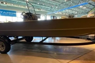 The Image of 2026 Tracker Grizzly 1860 CC boat on display in a showroom. - 0