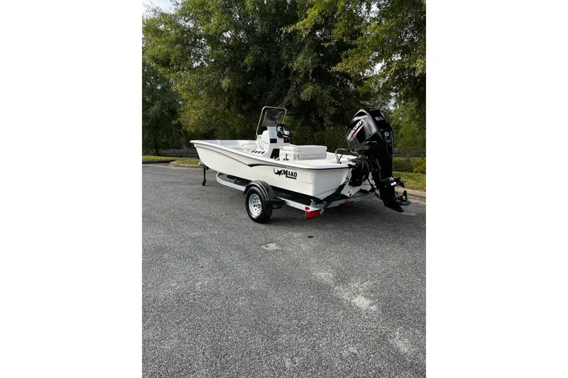 Slide: The Image of 2026 Mako Pro Skiff 15 CC boat on trailer, parked outdoors. - 3