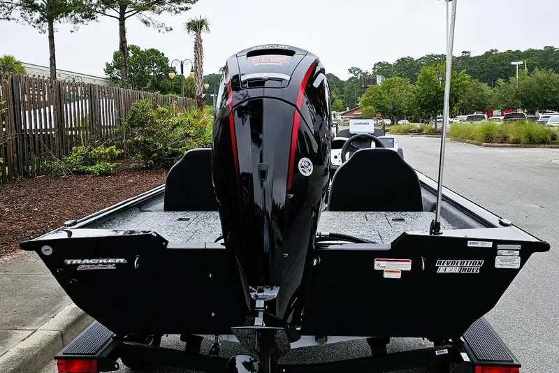Slide: The Image of 2026 Tracker Pro Team 190 boat with powerful outboard motor, parked outdoors. - 3