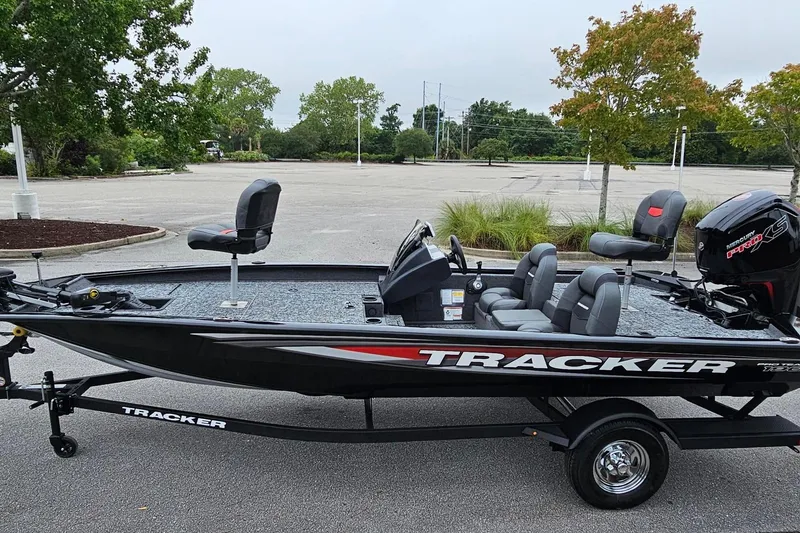 Slide: The Image of 2026 Tracker Pro Team 190 boat on trailer in parking lot. - 9