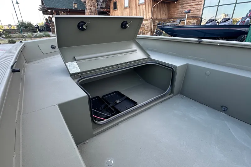 Slide: The Image of Open storage compartment in 2026 Tracker Grizzly 1650 T Prairie Wings Edition boat. - 21