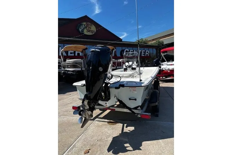 Slide: The Image of 2026 Mako Pro Skiff 17 CC boat at Bass Pro Shops, rear view. - 4