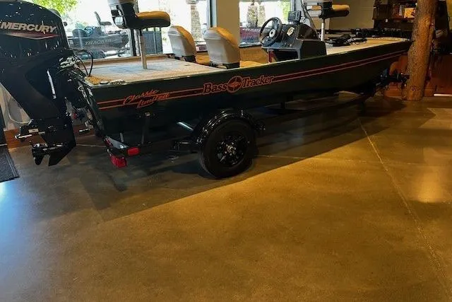 Slide: The Image of 2026 Tracker Bass Tracker Classic Limited boat displayed indoors on a polished floor. - 3