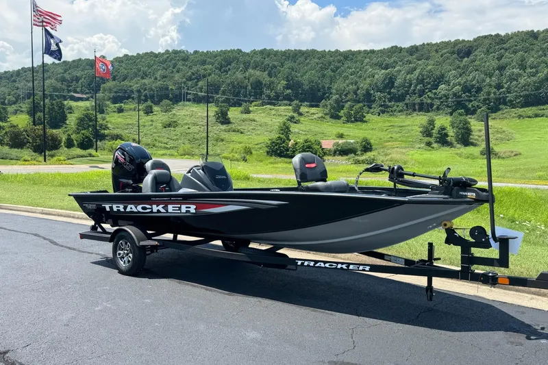 Slide: The Image of 2026 Tracker Pro Team 190 boat on trailer, parked with scenic green hills in background. - 1