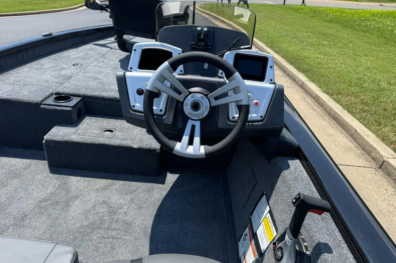 Slide: The Image of 2026 Tracker Pro Team 190 boat interior with steering wheel and control panel. - 5