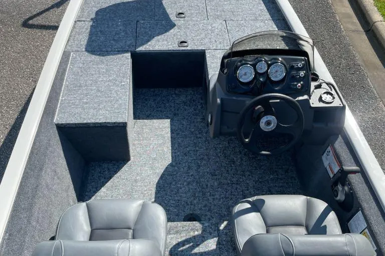 Slide: The Image of 2026 Tracker Pro 170 boat interior with steering console and seating. - 69