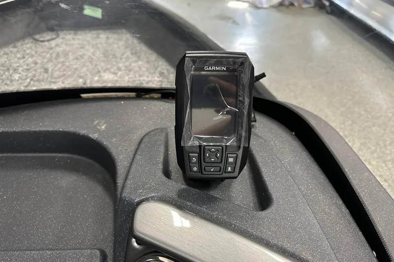 Slide: The Image of Garmin device on 2026 Tracker Pro Guide V-16 SC boat dashboard. - 16