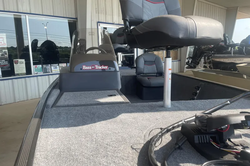 Slide: The Image of 2026 Tracker Bass Tracker Classic XL boat interior with seating and controls. - 10