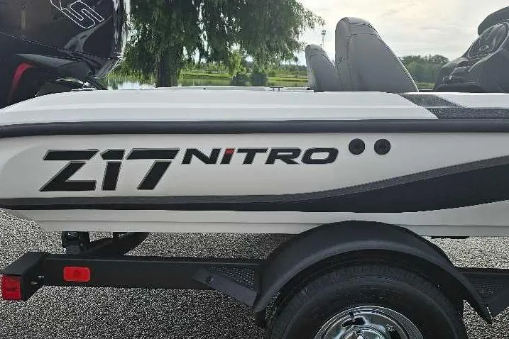 Slide: The Image of 2026 Nitro Z17 boat trailer with logo, parked outdoors. - 2