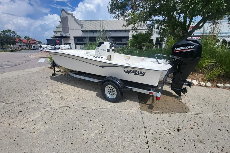 The Image of 2026 Mako Pro Skiff 15 CC boat on trailer with Mercury outboard motor. - 0