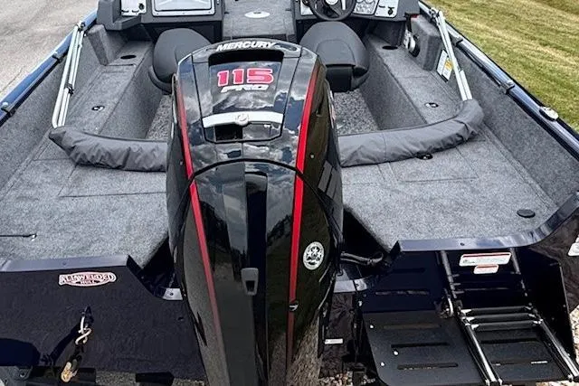 Slide: The Image of 2026 Tracker Pro Guide V-175 WT boat interior with four gray seats and motor. - 4