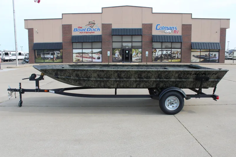 The Image of 2026 Tracker Grizzly 1754 Utility boat on trailer outside dealership. - 0