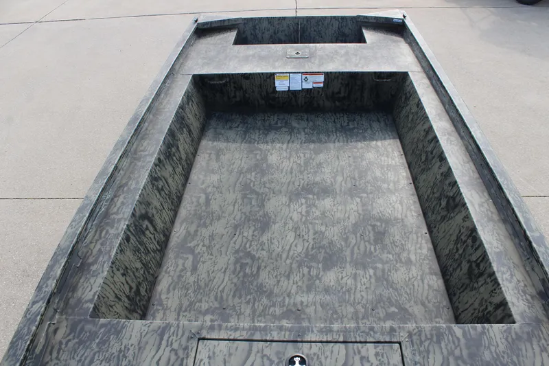 Slide: The Image of 2026 Tracker Grizzly 1754 Utility boat interior with camouflage design. - 12