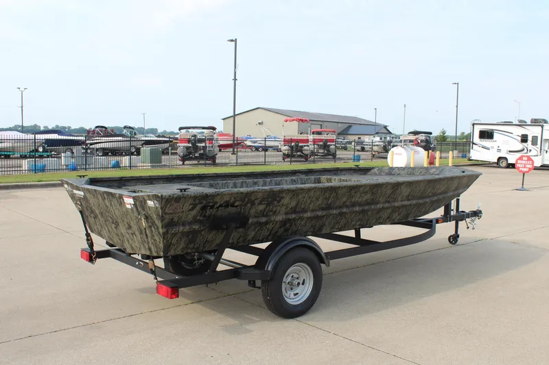 Slide: The Image of 2026 Tracker Grizzly 1754 Utility boat on trailer in outdoor lot. - 5
