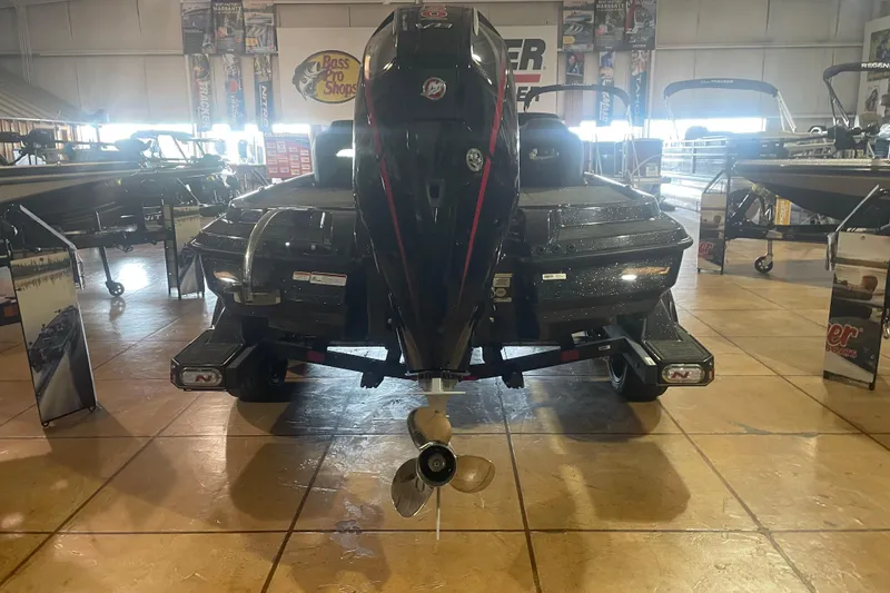 Slide: The Image of 2026 Nitro Z20 XL Pro boat displayed indoors with powerful outboard motor. - 2