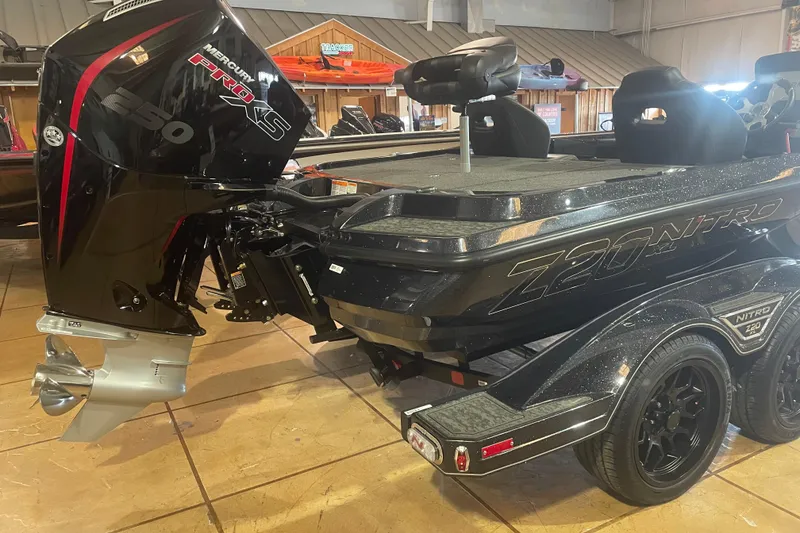 Slide: The Image of 2026 Nitro Z20 XL Pro boat with Mercury Pro XS engine in showroom. - 3