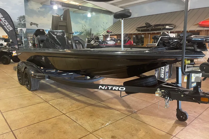 Slide: The Image of 2026 Nitro Z20 XL Pro boat displayed indoors on a trailer. - 4