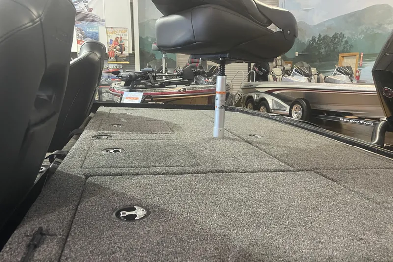 Slide: The Image of 2026 Nitro Z20 XL Pro boat interior with carpeted deck and adjustable seat. - 6