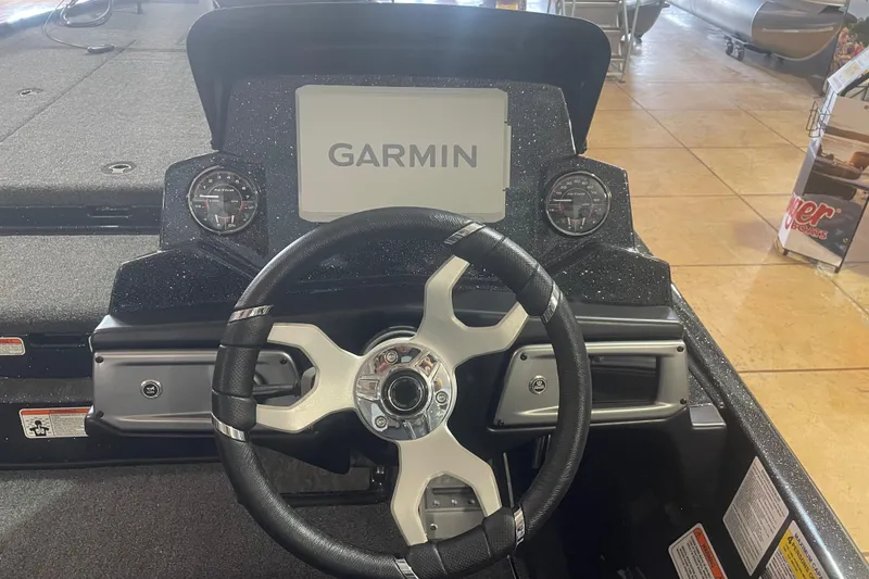 Slide: The Image of 2026 Nitro Z20 XL Pro boat dashboard with Garmin display and steering wheel. - 7