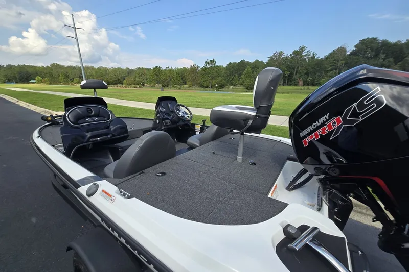 Slide: The Image of 2026 Nitro Z17 boat with Mercury Pro XS engine, parked on a scenic road. - 5