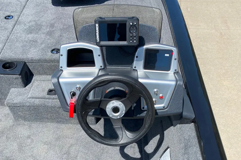 Slide: The Image of 2026 Tracker Pro Team 190 boat dashboard with steering wheel and navigation system. - 5