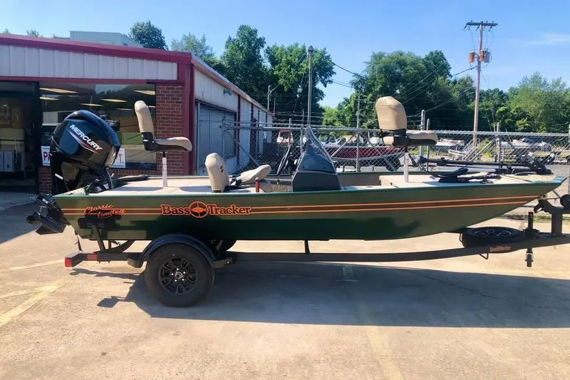 The Image of 2026 Tracker Bass Tracker Classic Limited boat parked outside a building on a sunny day. - 0
