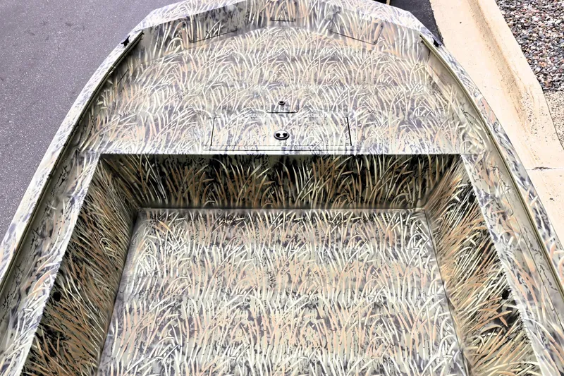 Slide: The Image of 2026 Tracker GRIZZLY 1860 Utility boat with camouflage interior design. - 2