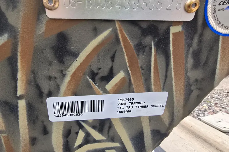 Slide: The Image of 2026 Tracker GRIZZLY 1860 Utility with camouflage pattern and identification labels. - 6