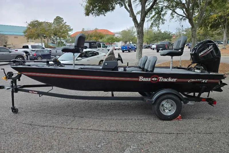 Slide: The Image of 2026 Tracker Bass Tracker Classic XL boat on trailer in parking lot. - 5