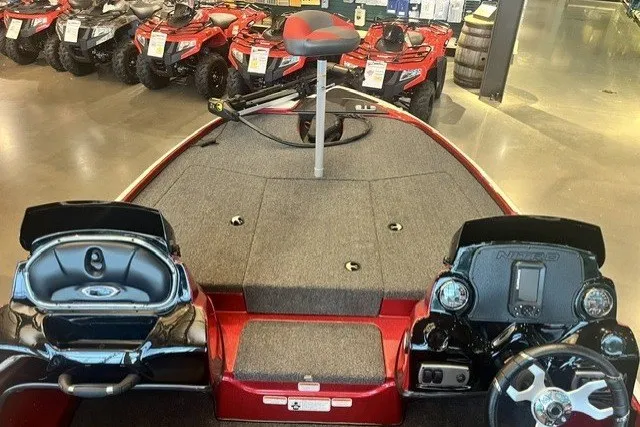 Slide: The Image of Red Nitro Z17 boat interior with dual consoles, steering wheel, and elevated seat, 2026 model. - 8