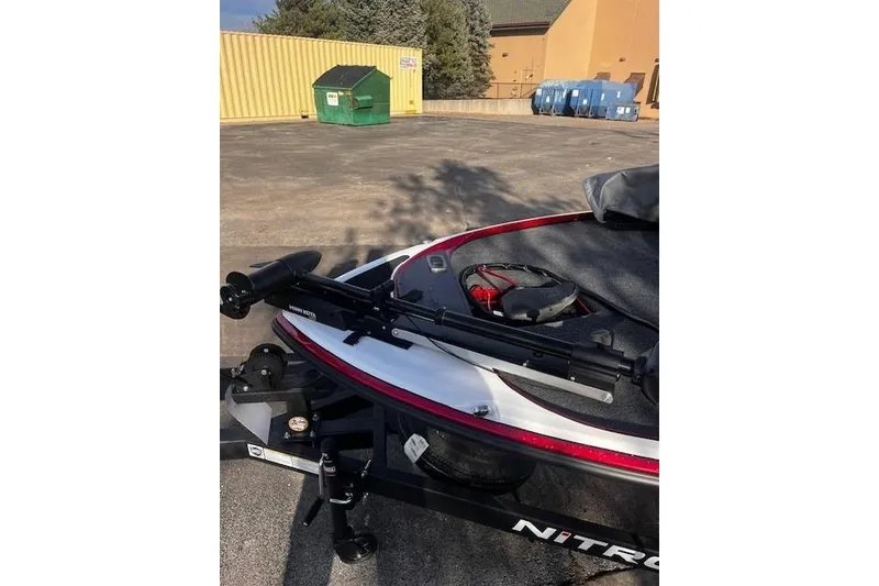 Slide: The Image of 2026 Nitro Z17 boat with mounted equipment in a parking area. - 92