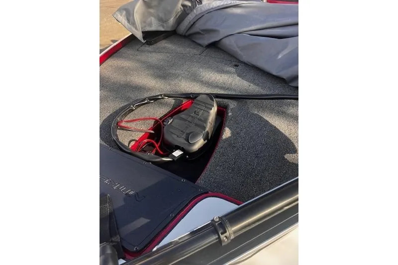 Slide: The Image of 2026 Nitro Z17 boat interior with carpeted deck and storage compartment. - 93