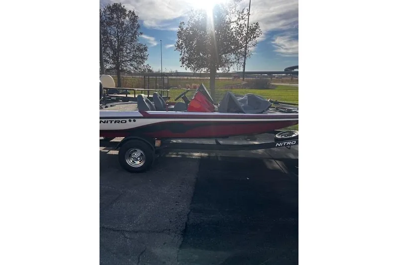 Slide: The Image of 2026 Nitro Z17 boat on trailer, parked outdoors under a sunny sky. - 94