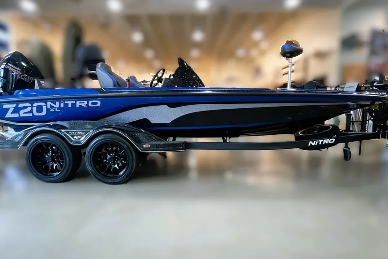 The Image of 2026 Nitro Z20 XL Pro boat on trailer, parked outdoors, side view. - 0
