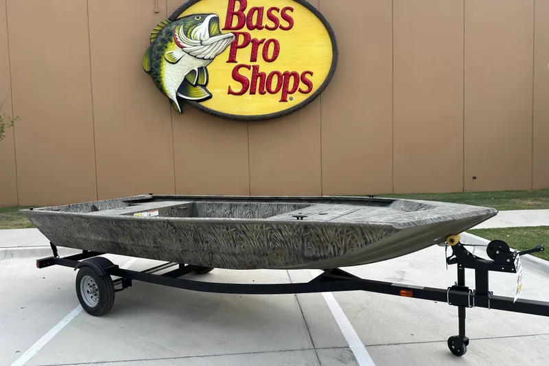 The Image of 2026 Tracker Grizzly 1648 Utility boat on trailer at Bass Pro Shops. - 1