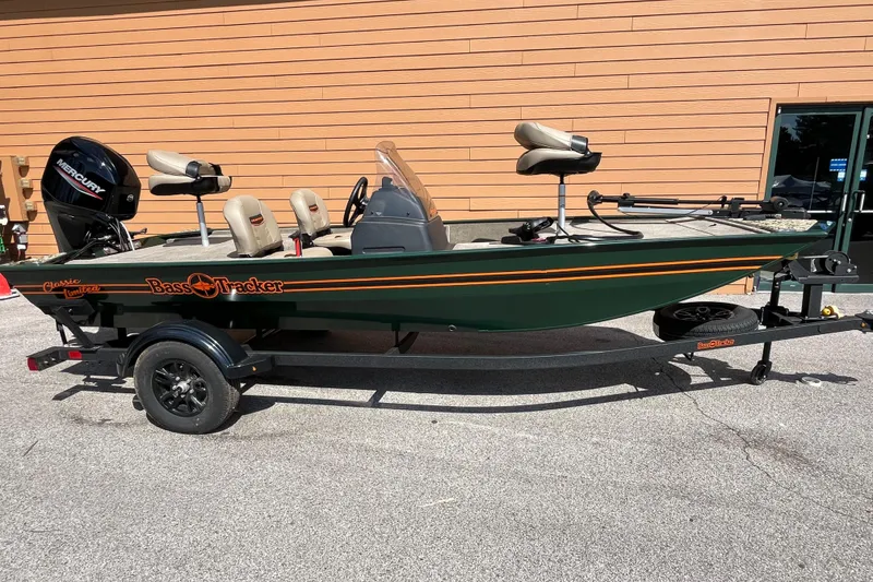 The Image of 2026 Tracker Bass Tracker Classic Limited fishing boat on trailer, parked outdoors. - 0
